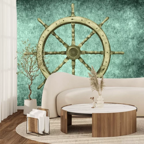Fototapete Holzsteuerrad eines Schiffes vor einem Betonhintergrund