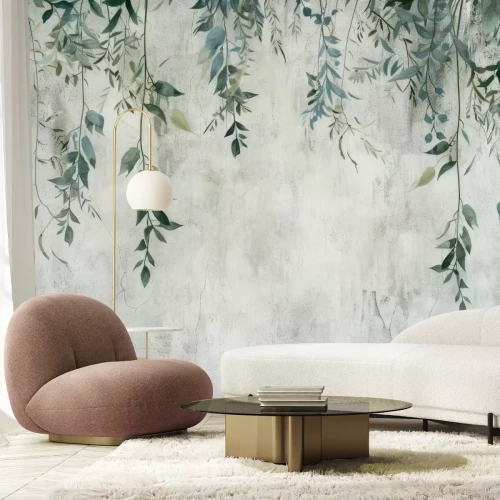 Fototapete Blätter, die von oben auf einem grauen Betonhintergrund hängen