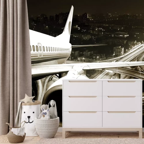 Fototapete Flugzeug vor der Stadtkulisse bei Nacht