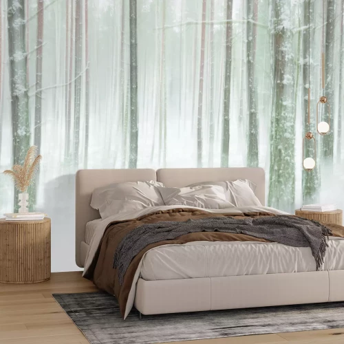 Fototapete Baumstämme im dichten weißen Schnee