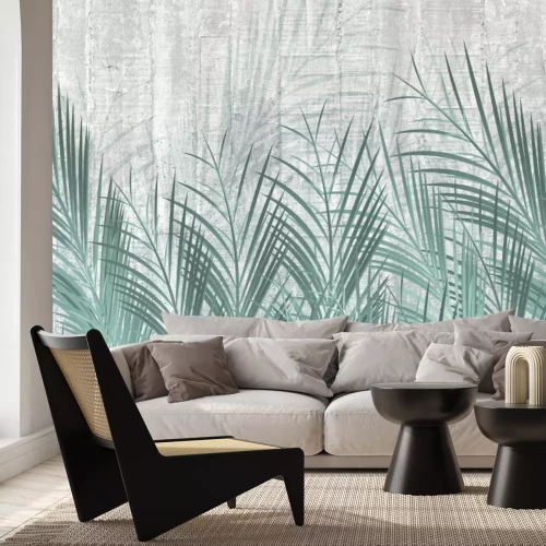 Fototapete Grüne Palmblätter auf Beton