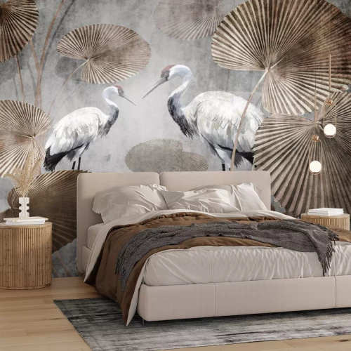 Fototapete Weiße Kraniche zwischen großen tropischen Blättern
