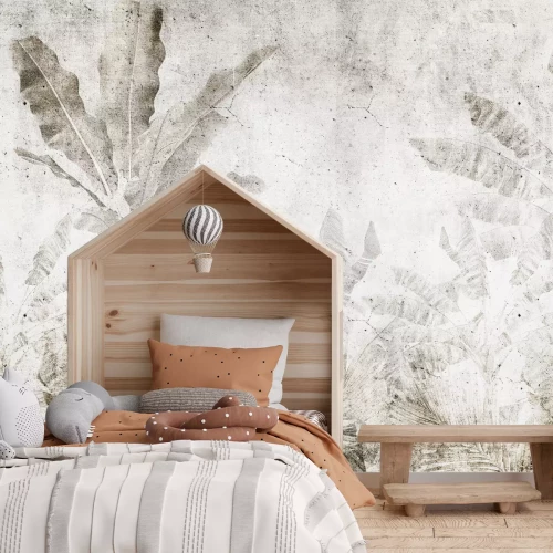 Fototapete Bananenblätter an einer Betonwand im Urban-Jungle-Stil