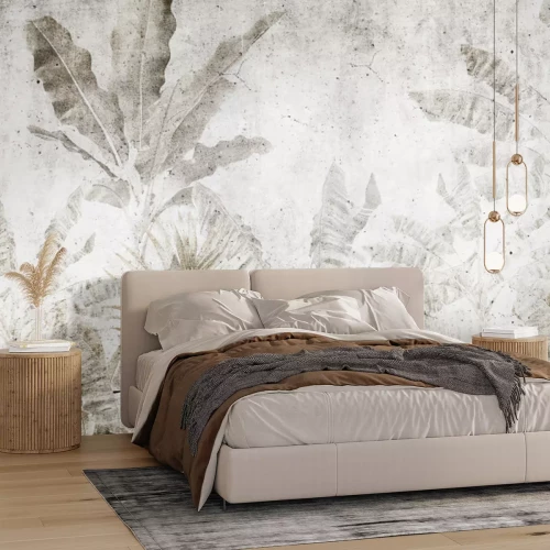 Fototapete Bananenblätter an einer Betonwand im Urban-Jungle-Stil