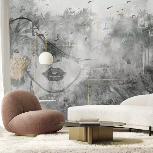 Fototapete Abstraktes Porträt einer Frau mit tropischen Pflanzen auf Betonhintergrund