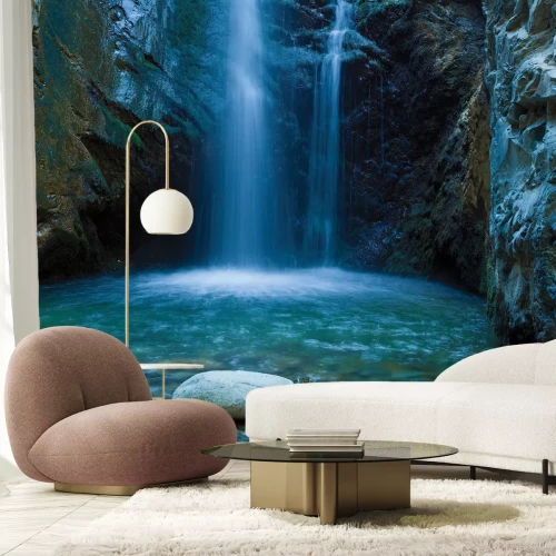 Fototapete Höhle mit einem Wasserfall und Felsen