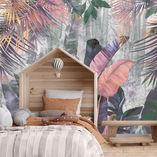 Fototapete Bunte Palm- und Bananenblätter auf Betonhintergrund