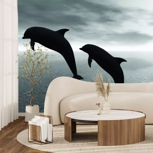 Fototapete Schwarzweißfoto von Delfinen vor Wasserhintergrund
