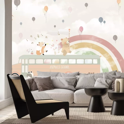 Fototapete Schulbus mit Tieren vor einem Regenbogenhintergrund