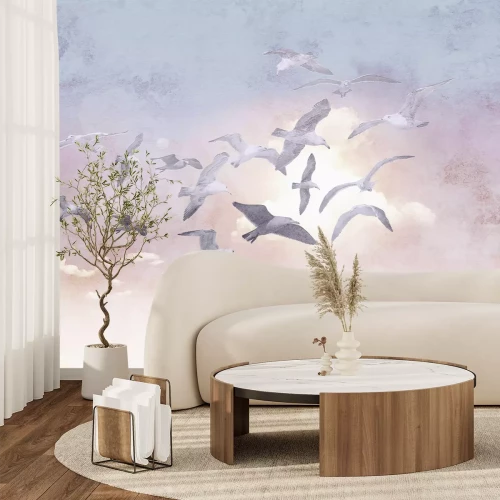 Fototapete Fliegende Vögel vor zartem Himmel