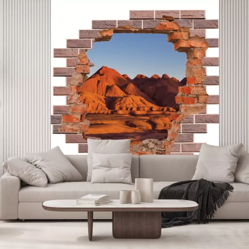 Sticker 3D-Loch in einer Backsteinmauer mit Blick auf eine Wüstenlandschaft