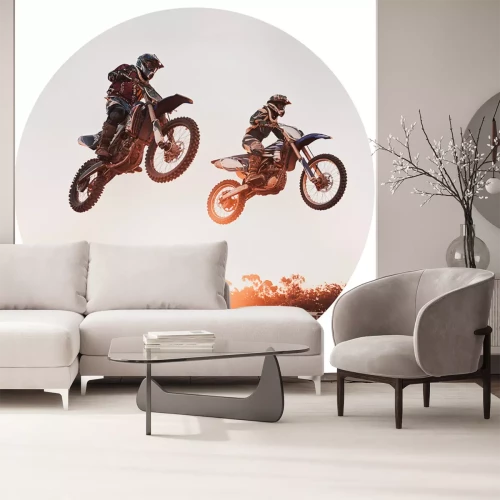 Sticker Motocross-Fahrer in der Luft vor dem Hintergrund eines Sonnenuntergangs