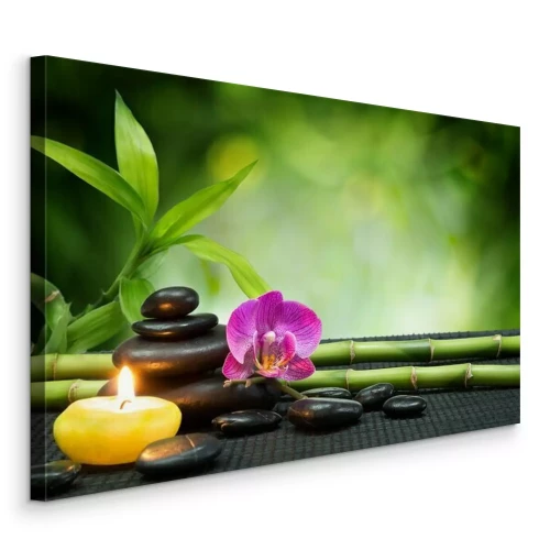 Bild Spa-Steine und eine Orchidee auf einer Bambusmatte