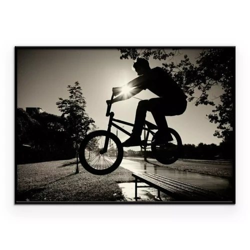 Poster Ein Sepiafoto eines Jungen auf einem Fahrrad