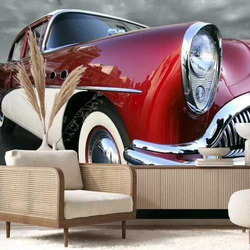 Fototapete Ein rotes Retro-Auto vor dunklem Himmel