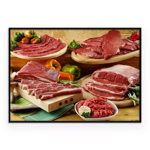 Poster Eine Auswahl an rohen Fleischstücken, die auf Brettern angerichtet sind.