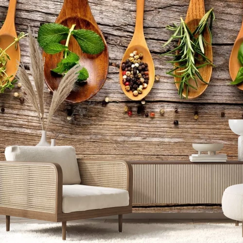 Fototapete Verschiedene Gewürze und Kräuter auf Holzlöffeln angerichtet