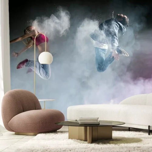 Fototapete Springende Tänzer umgeben von Rauch und Licht