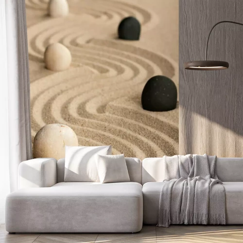 Sticker Linie schwarze und weiße Steine, die auf dem Sand stehen