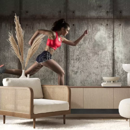 Fototapete Eine laufende Frau in Sportkleidung im Profil