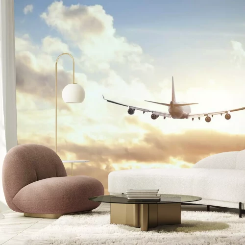 Fototapete Ein Flugzeug über den Wolken