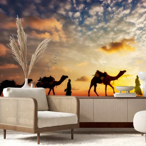 Fototapete Silhouetten von Menschen und Kamelen in der Wüste