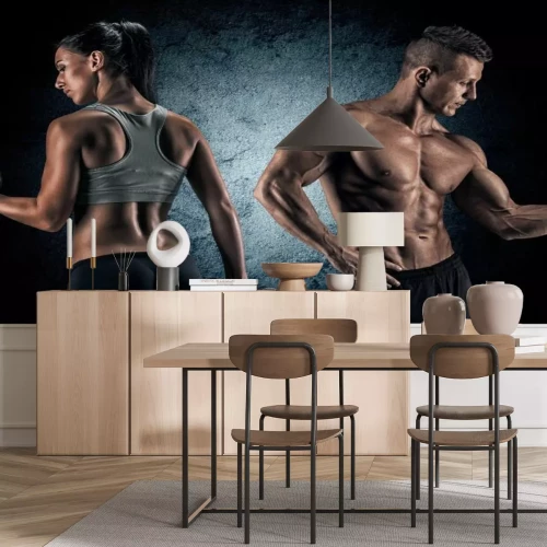 Fototapete Sportliche Frau und Mann mit Gewichten