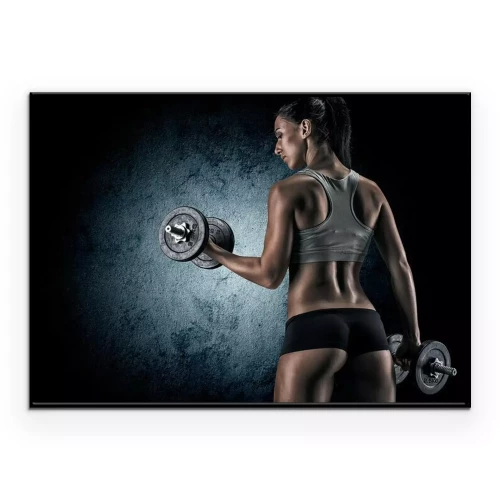 Poster Muscular woman in studio on dark background
