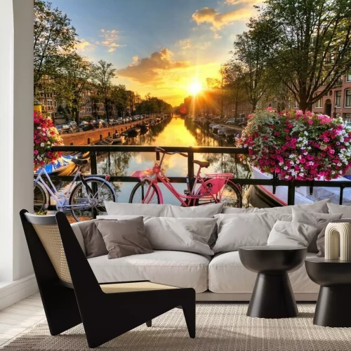 Sticker Beautiful sunrise over Amsterdam, The Netherlands, with flowers and bicycles on the bridge in spring