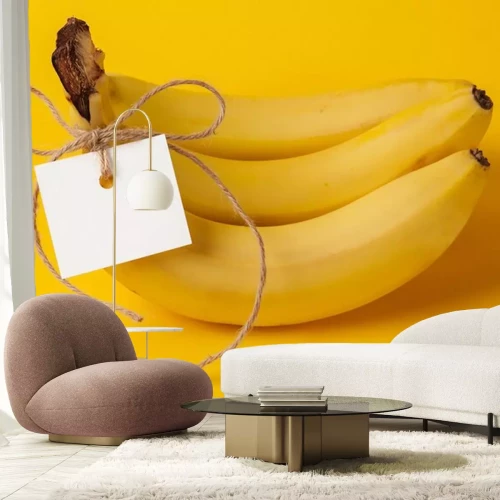 Sticker Mit Schnur gebundene Bananen auf gelbem Hintergrund