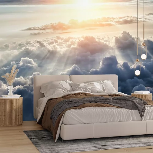 Fototapete Sonne über dichten Wolken