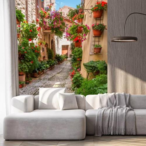 Fototapete Rote Geranien an Mauern