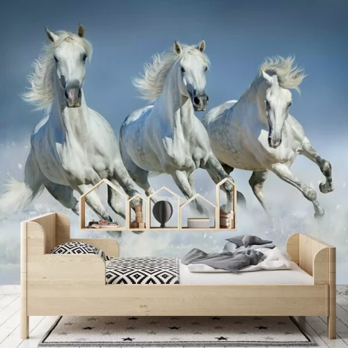 Fototapete Weiße Pferde galoppieren im Schnee