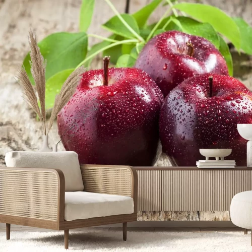 Sticker Drei bordeauxrote Äpfel auf dem Tisch