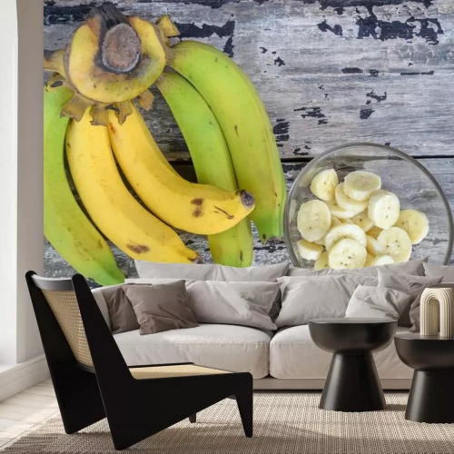 Sticker Ganze und in Scheiben geschnittene Bananen in einer Schüssel