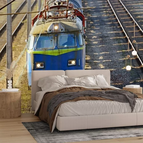 Fototapete Ein blauer Zug auf den Gleisen