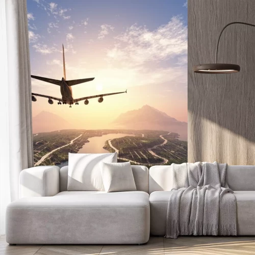 Fototapete Ein Flugzeug fliegt über eine Insel