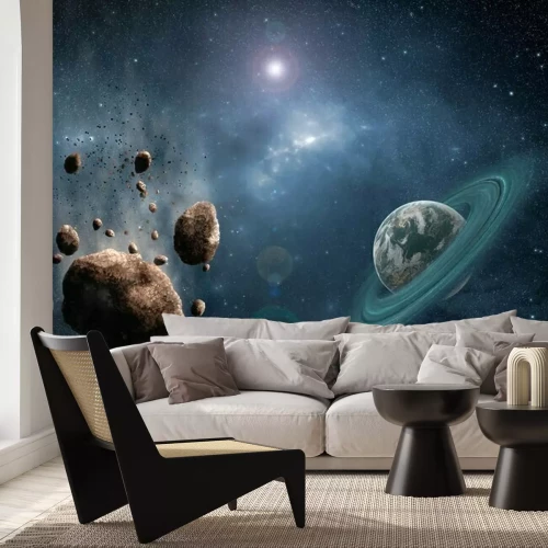 Fototapete Asteroiden und ein Planet mit einem Ring im Weltraum