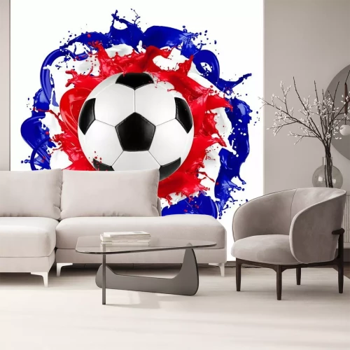 Sticker Ein Fußball mit Farbspritzern in den Farben der französischen Flagge