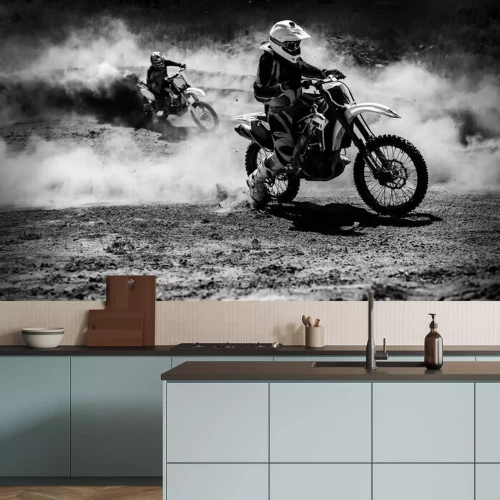 Fototapete Motocross racer accelerating in dust track, Black and white photo