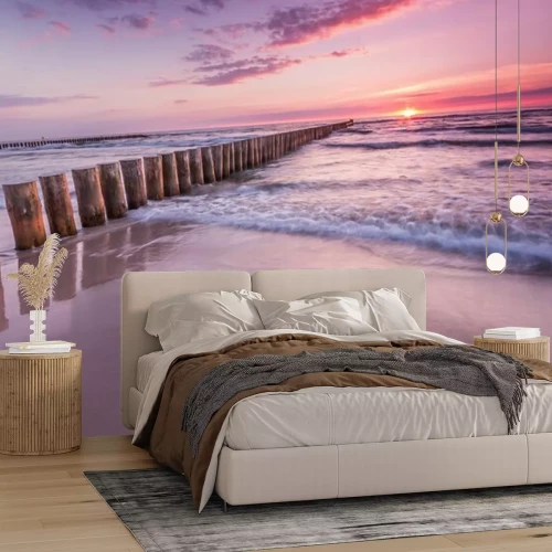 Fototapete Strand Wellenbrecher und violetter Himmel