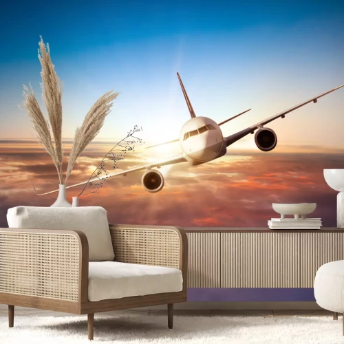 Fototapete Flugzeug vor dem Hintergrund des Sonnenuntergangs