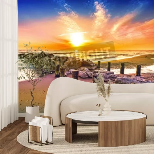 Fototapete Sonnenuntergang und Meereswellenbrecher