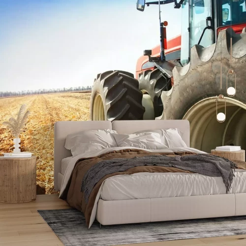 Fototapete Traktor auf dem Feld von hinten