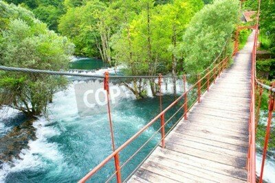 Fototapete Brücke über azurblauem Fluss