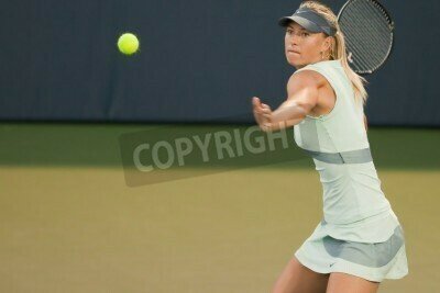 Fototapete Tennisspielerin schlägt den Ball zurück