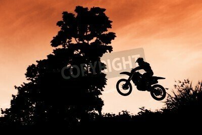 Fototapete Motocross-Springen bei Sonnenuntergang